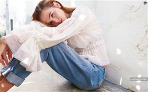 Zoey Deutch in classic outfit of denims and white top